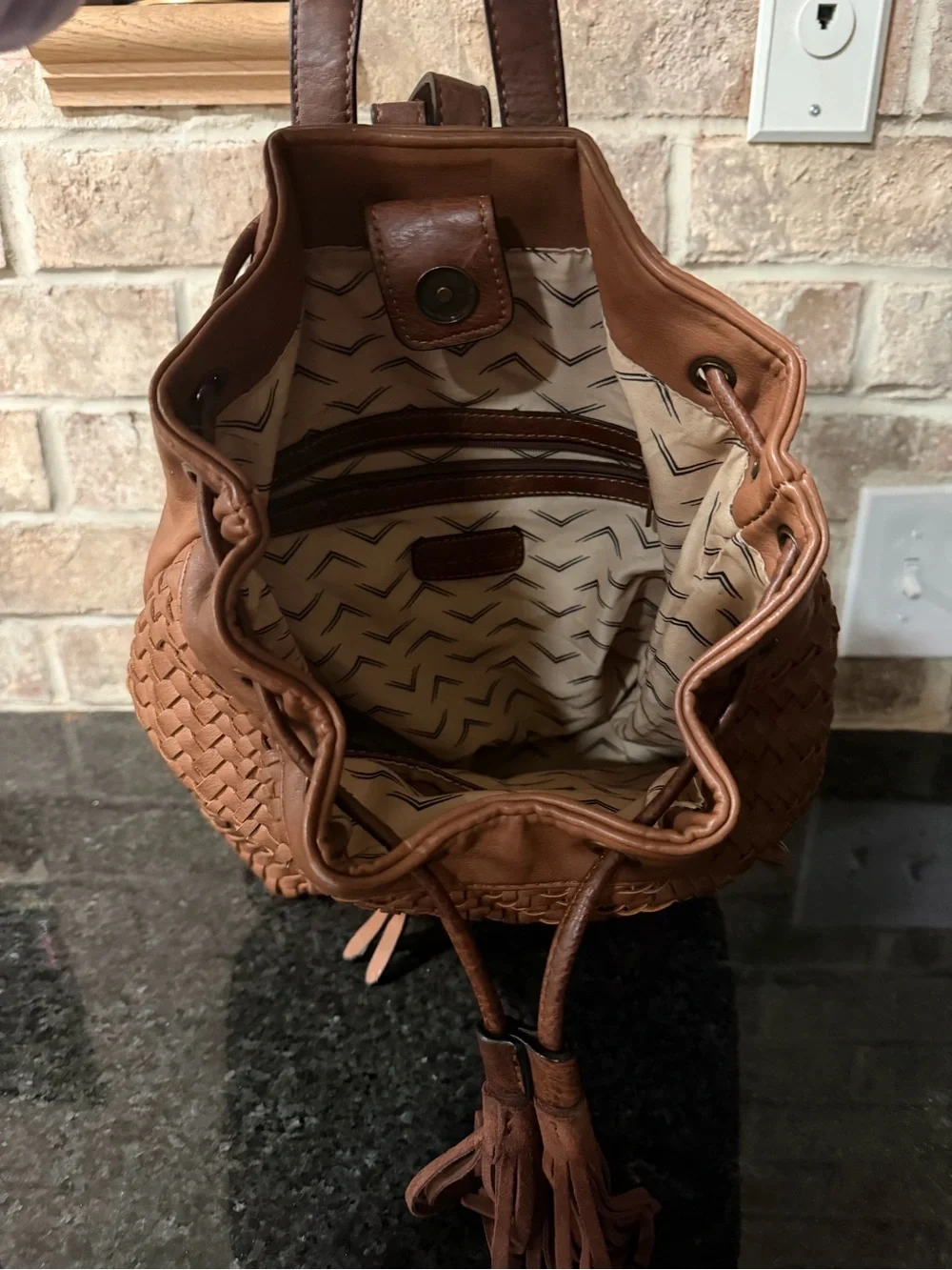 Altar'd State Woven Leather Tassel Backpack in Brown